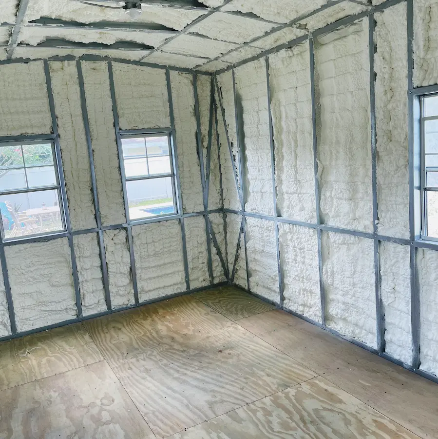 Closed-cell spray foam insulation applied to wall cavities in a residential project in Poplar Grove